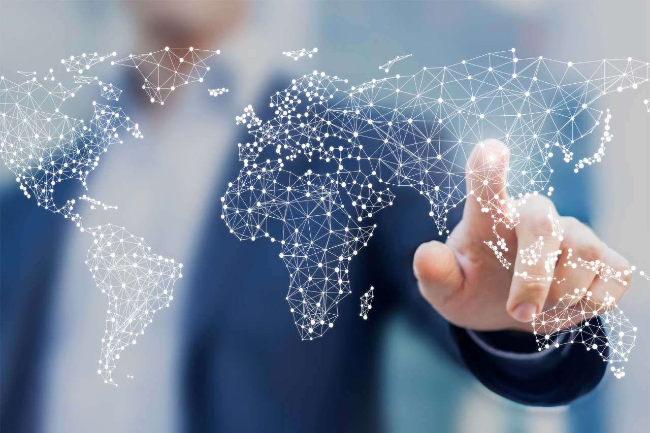 Global business and finance concept with businessman touching world map with connected dots in network architecture for telecommunication, internet of things, financial technology, data servers